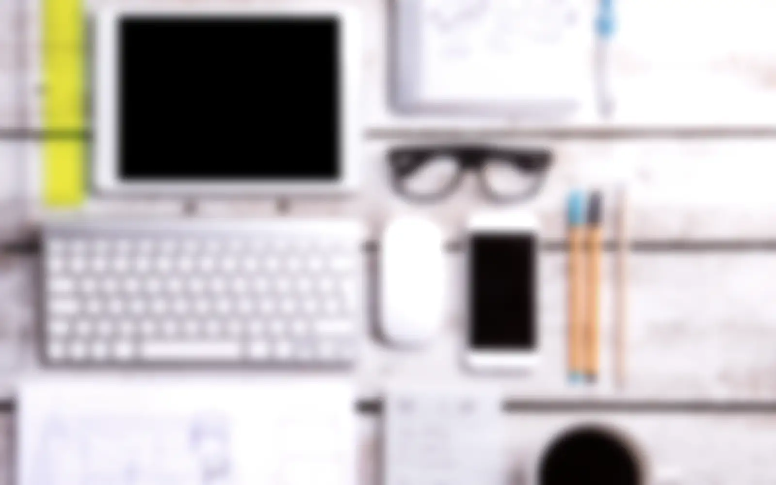 Desk with a tablet, phone and keyboard (stock photo)