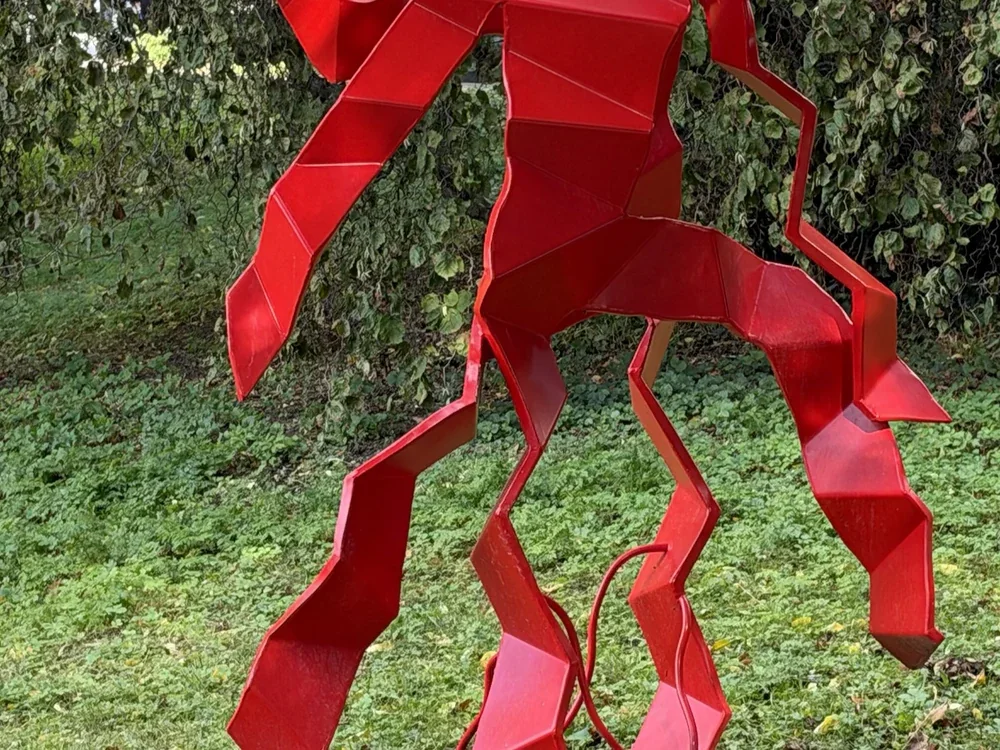 Red sculpture, photographed with the iPhone 18 Pro, centre crop