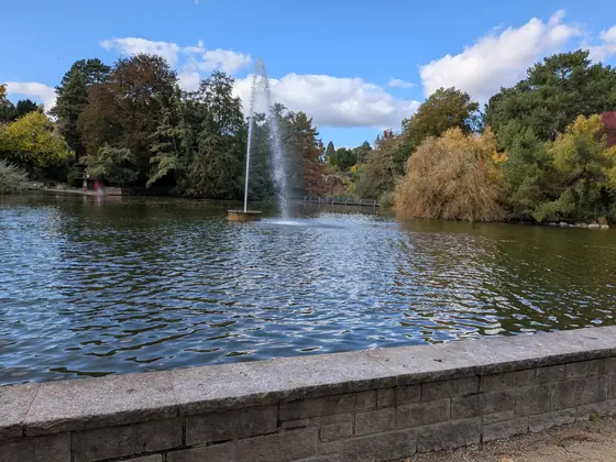Photo B: fountain and pond with autumn trees
