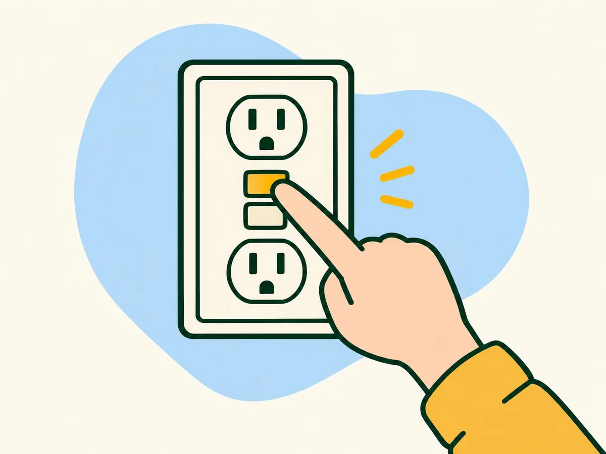 Illustration of a finger pressing one of the two buttons between the sockets of a wall outlet