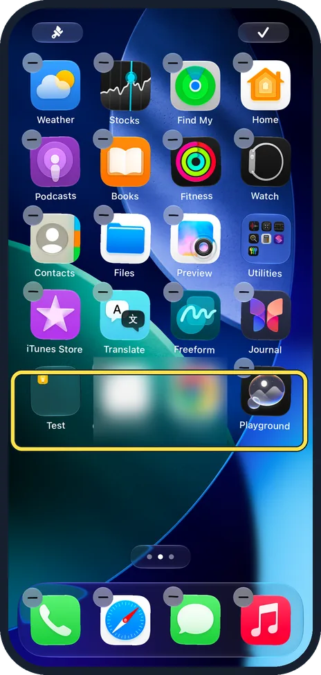 iPhone screen: Drag the apps out to delete the folder