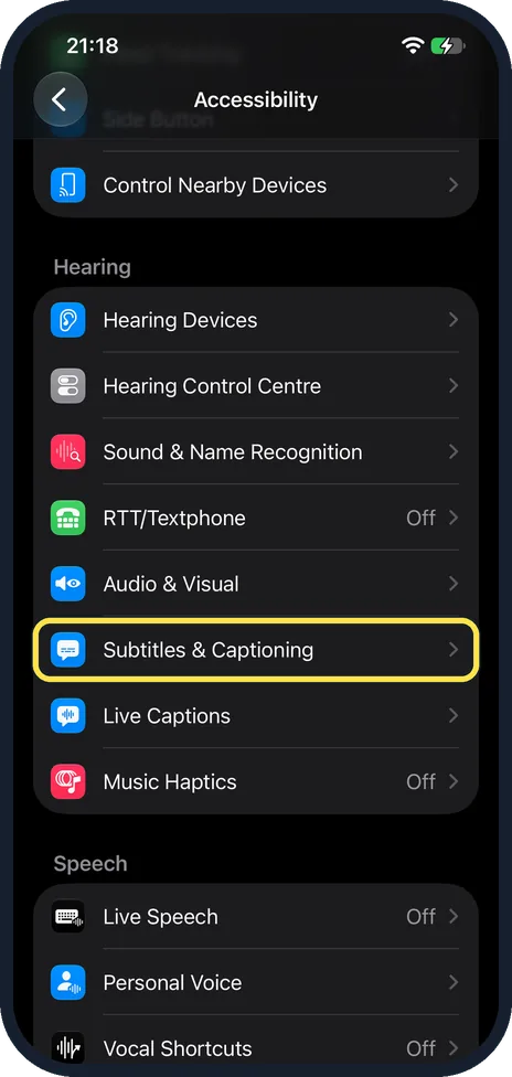 iPhone screen: Scroll to Hearing and tap Subtitles & Captioning